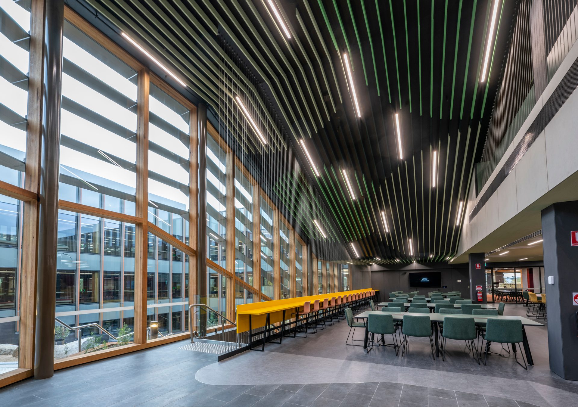 Light-filled project space with timber louvres and communal seating