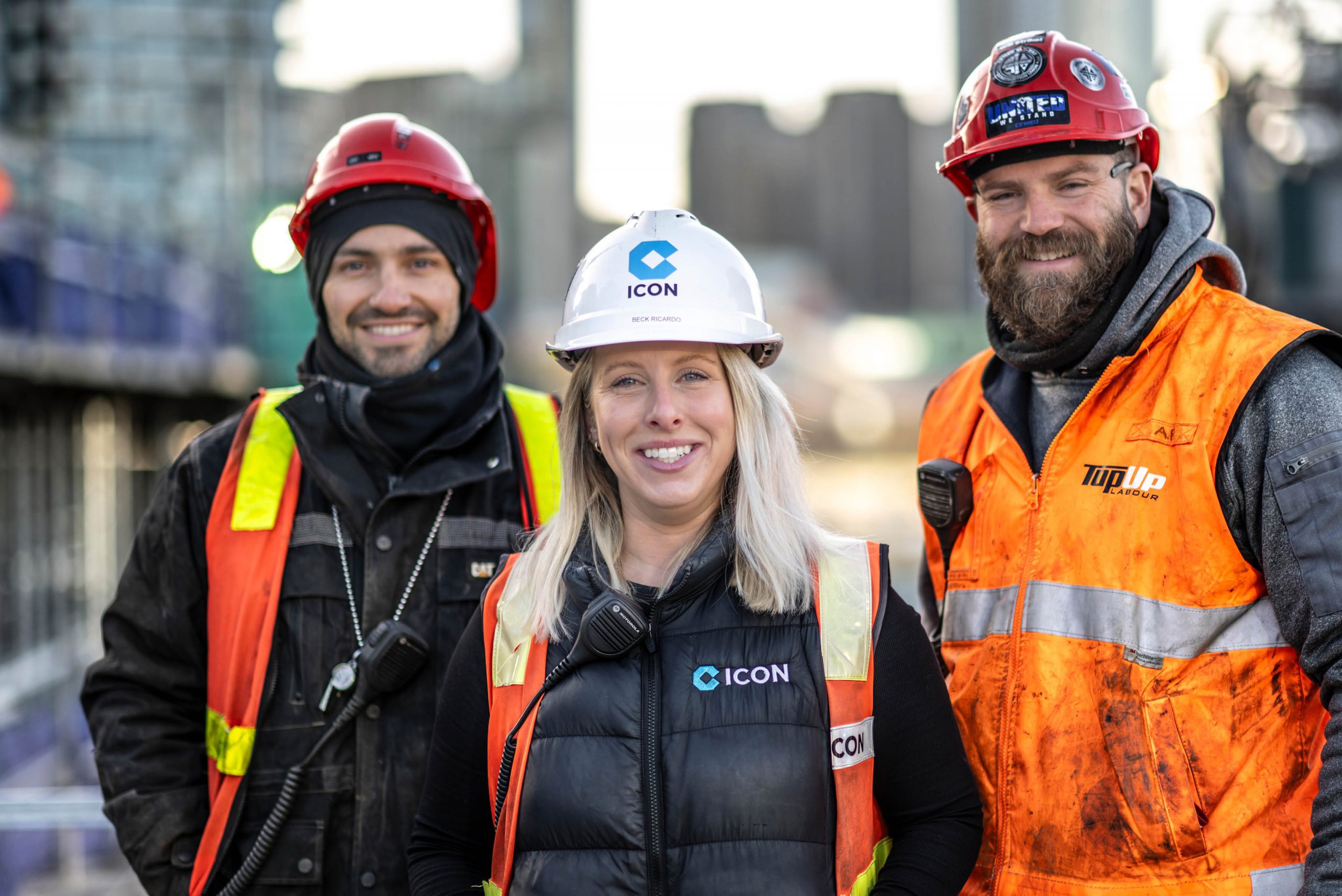 Three Icon team members on site in hi-vis and hard hats